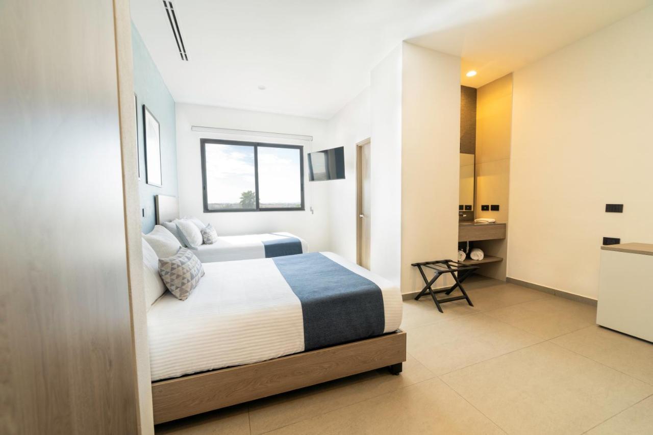 Th Hotel & Vivienda تيباتيتلان دي موريلوس المظهر الخارجي الصورة
