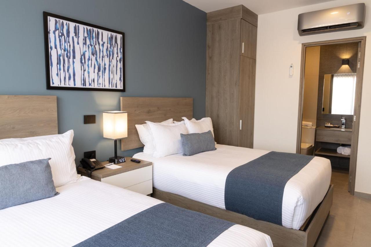 Th Hotel & Vivienda تيباتيتلان دي موريلوس المظهر الخارجي الصورة